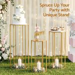 Elegant gold stands displaying cake and champagne