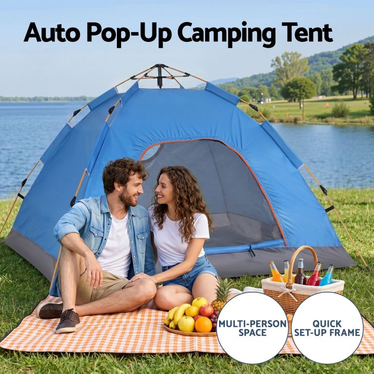 Couple beside auto pop-up camping tent by lake
