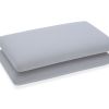 Two grey pillows stacked on white background