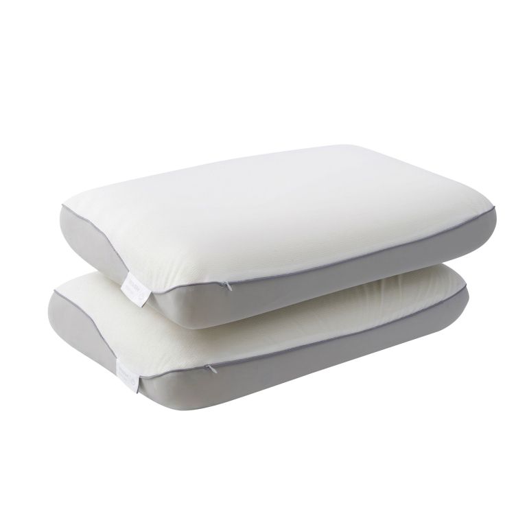 Two white contoured memory foam pillows stacked