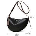 black stylish genuine leather crescent shape shoulder bag for women – compact grained cowhide adjustable crossbody handbag with spacious zipper compartment and leather puller, 28 x 18 x 9 cm